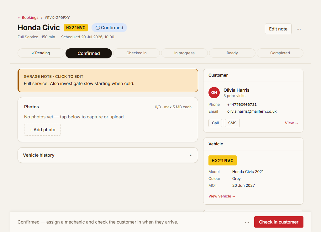 The real RevIXO booking detail for Olivia's Honda Civic showing the job sheet status as Confirmed.